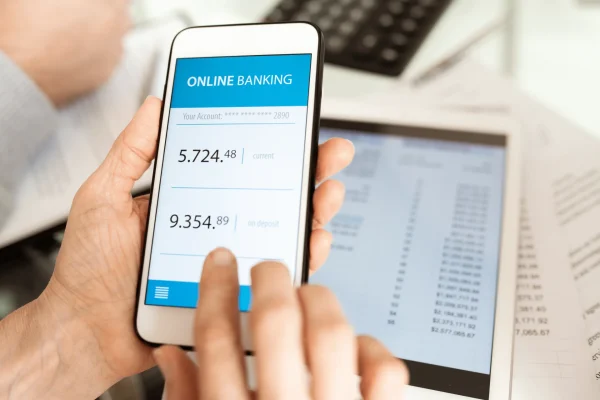 Phone screen with an online banking app open. Top is the current bank account which 5.724.48. Below is the on deposit with 9.345.89

Having a separate bank account for your personal and business account, Envato
