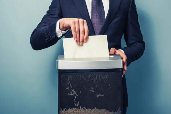 Business person shredding a document with a shredder

Shredding sensitive information with a shredder, Exhibit Indexes