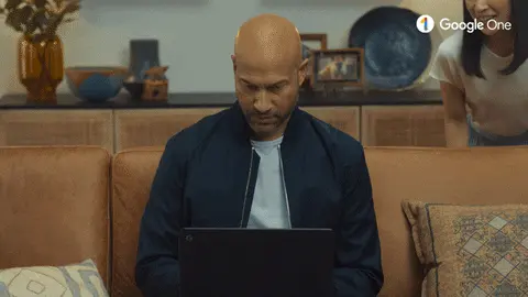 Someone looking down at their laptop